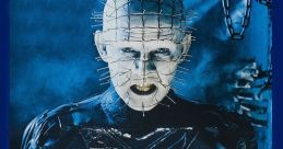 Pinhead from Hellraiser (1987) holds the iconic Lament Configuration, surrounded by dark, eerie atmosphere and chains.