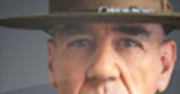 R Lee Ermey in military attire, showcasing his iconic stern expression and leadership presence. Official image of the actor.