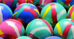 Colorful, patterned balls arranged closely together, showcasing vibrant hues of pink, blue, green, and yellow.