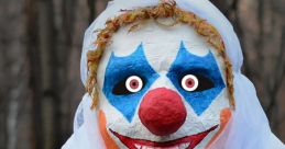 Eerie clown with bright face paint and red nose, shrouded in white, surrounded by dark trees in a spooky setting.