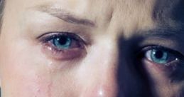 Emotional close-up of a woman crying, showcasing tears and a pained expression, evoking deep feelings of sadness.