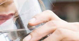 Woman enjoying a refreshing glass of cold water, promoting hydration and healthy drinking habits.