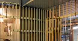 Abandoned prison cell featuring rusty bars and a stark interior, highlighting the harsh environment of jail life.