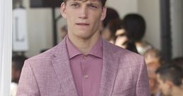 Stylish male model in a pink blazer and shirt, showcasing contemporary men's fashion on the runway.