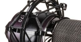 Close-up of a professional microphone in a shock mount setup, ideal for studio recording and sound quality enhancement.