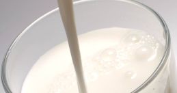 Creamy milk pouring into a glass, highlighting its rich texture and freshness. Perfect for smoothies or breakfast.