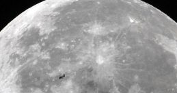 Detailed view of the Moon's surface craters, featuring the International Space Station in the background.