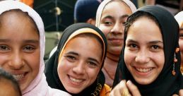 Smiling group of young girls in colorful clothing, showcasing joy and friendship in a vibrant market setting.