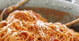 Delicious spaghetti tossed in a rich tomato sauce, served in a large pan, perfect for a hearty meal or gathering.