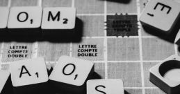 Scrabble letters arranged on a game board, showcasing creativity and word building in a classic word game.