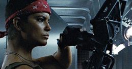 Pvt. Vasquez, armed and ready, stands confidently in an alien spacecraft, showcasing her strength and determination.