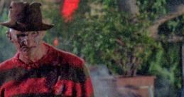 Freddy Krueger stalks through fog in a classic striped sweater, embodying horror from *A Nightmare on Elm Street 2*.