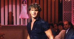 Johnny Castle performing an iconic dance move during a show in "Dirty Dancing," capturing the film's passion and energy.