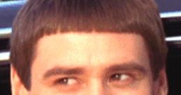 Lloyd Christmas smiles brightly from a car, showcasing his iconic bowl cut in the classic comedy "Dumb & Dumber.