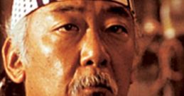 Mr. Miyagi, the wise mentor from The Karate Kid, conveying strength and wisdom with a focused expression and iconic headband.