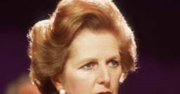 Margaret Thatcher in a blue suit, attentively listening at a conference, showcasing her iconic leadership style.