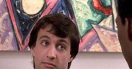 Serge from Beverly Hills Cop interacting in an art gallery setting, showcasing his distinctive style and humor.