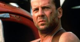 John McClane in a tank top with a gun holster, showcasing his rugged look and determination in "Die Hard.