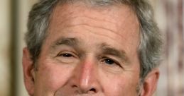 George W. Bush smiling in a formal setting, wearing a suit with a red tie, showcasing his approachable demeanor.