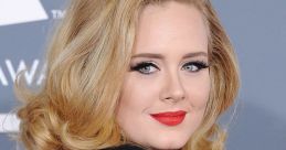 Adele at a glamorous event, showcasing her iconic hairstyle and red lipstick, captivating the audience with her elegance.