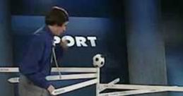 Alan Partridge presents sports predictions with a humorous twist, featuring World Cup 94 themes and a soccer ball display.