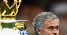 Jose Mourinho celebrates with the Premier League trophy, highlighting his successful reign at Chelsea FC.