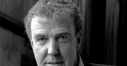 Jeremy Clarkson smiling, wearing a blazer, known for his role in Top Gear and engaging automotive commentary.