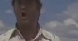 Truck driver from "Thelma & Louise" passionately expressing frustration in a dusty landscape.