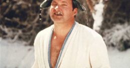 Cousin Eddie in a white robe and fur hat, enjoying a drink in the snowy landscape from the movie "Vacation.