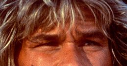 Bodhi from Point Break, showcasing his intense expression and iconic surfer look, a key character in the film's thrilling narrative.