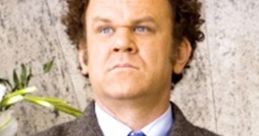 Dale from Step Brothers stands confidently with arms crossed, dressed in a blazer and tie, exuding unique charisma.