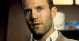 Jason Statham in a sharp suit, showcasing his iconic look from the film "Snatch," embodying a gritty, stylish vibe.