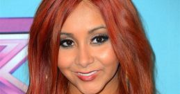 Nicole Polizzi, known as Snooki, smiles with vibrant red hair and glamorous jewelry at a formal event.