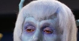 Blue-skinned alien character from Star Trek, featuring unique facial features and distinctive light-colored hair.