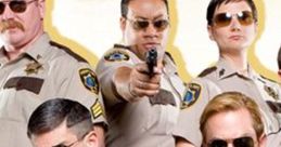 Reno 911! characters in uniform aiming guns, showcasing comedic police antics and unique personalities in a group pose.