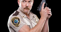 Lt. Jim Dangle from Reno 911! strikes a pose with a gun, showcasing his iconic sheriff uniform and mustache.