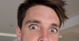 LazarBeam making a funny face in casual attire, showcasing his playful personality and engaging content style.