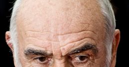 Close-up portrait of Sean Connery, showcasing his distinguished features and iconic beard, embodying classic Hollywood charisma.