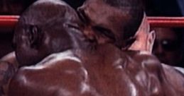 Mike Tyson biting Evander Holyfield during their infamous boxing match, highlighting a controversial moment in sports history.