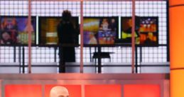 Host gestures while contestant faces "No Deal" on the set of "Deal Or No Deal," showcasing game show's tension and excitement.