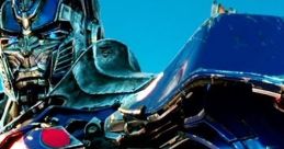 Close-up of Optimus Prime showcasing his iconic blue and red armor under a clear sky, signifying strength and heroism.