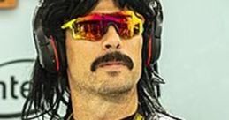 Dr. Disrespect cosplay featuring iconic hairstyle, sunglasses, and tactical vest at a gaming event.