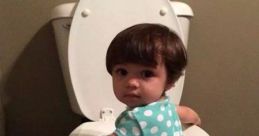 Toddler sitting on a toilet, showcasing a humorous and cute moment in kids' potty training adventures.