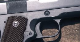 Detailed view of a semi-automatic gun resting on a rocky surface, highlighting its sleek design and textured grip.