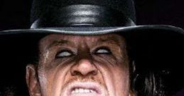 The Undertaker with intense expression, wearing a black hat, embodies the mystique of WWE's legendary wrestling character.