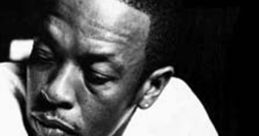 Portrait of Dr. Dre in black and white, showcasing his thoughtful expression and iconic style. A hip-hop legend in music history.