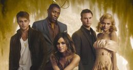 Main cast of "Hart of Dixie," featuring four men and a woman against a warm, scenic background with vintage suitcases.