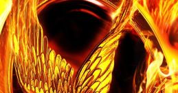 Golden Mockingjay emblem surrounded by flames, symbolizing rebellion and hope in The Hunger Games series.