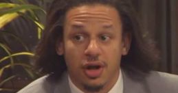 Eric Andre animatedly discussing themes with a snack in hand on set, showcasing the show's quirky humor and style.