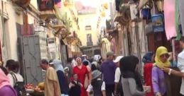 Bustling Tangier street scene with Arabic crowds, showcasing vibrant culture and daily life in Morocco's historic city.